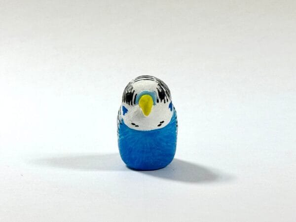 Clay parakeet totem from Featherlight Talimals series
