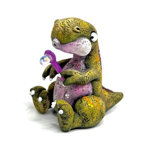 Cute clay Handmade Jurassic Zubaloo t-rex in yellow polymer clay with leaves