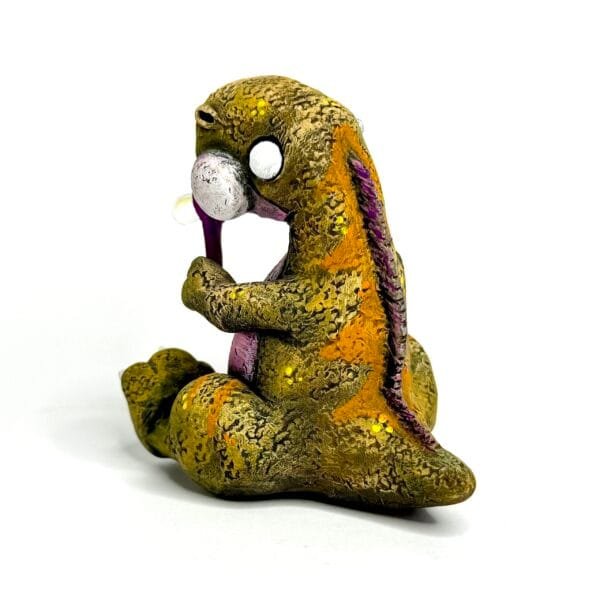 Handmade Jurassic Zubaloo Tyrannosaurus Rex in yellow polymer clay with leaves
