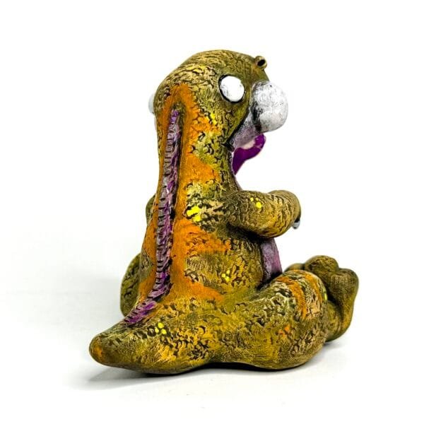 Handmade Jurassic Zubaloo Tyrannosaurus Rex in yellow polymer clay with leaves